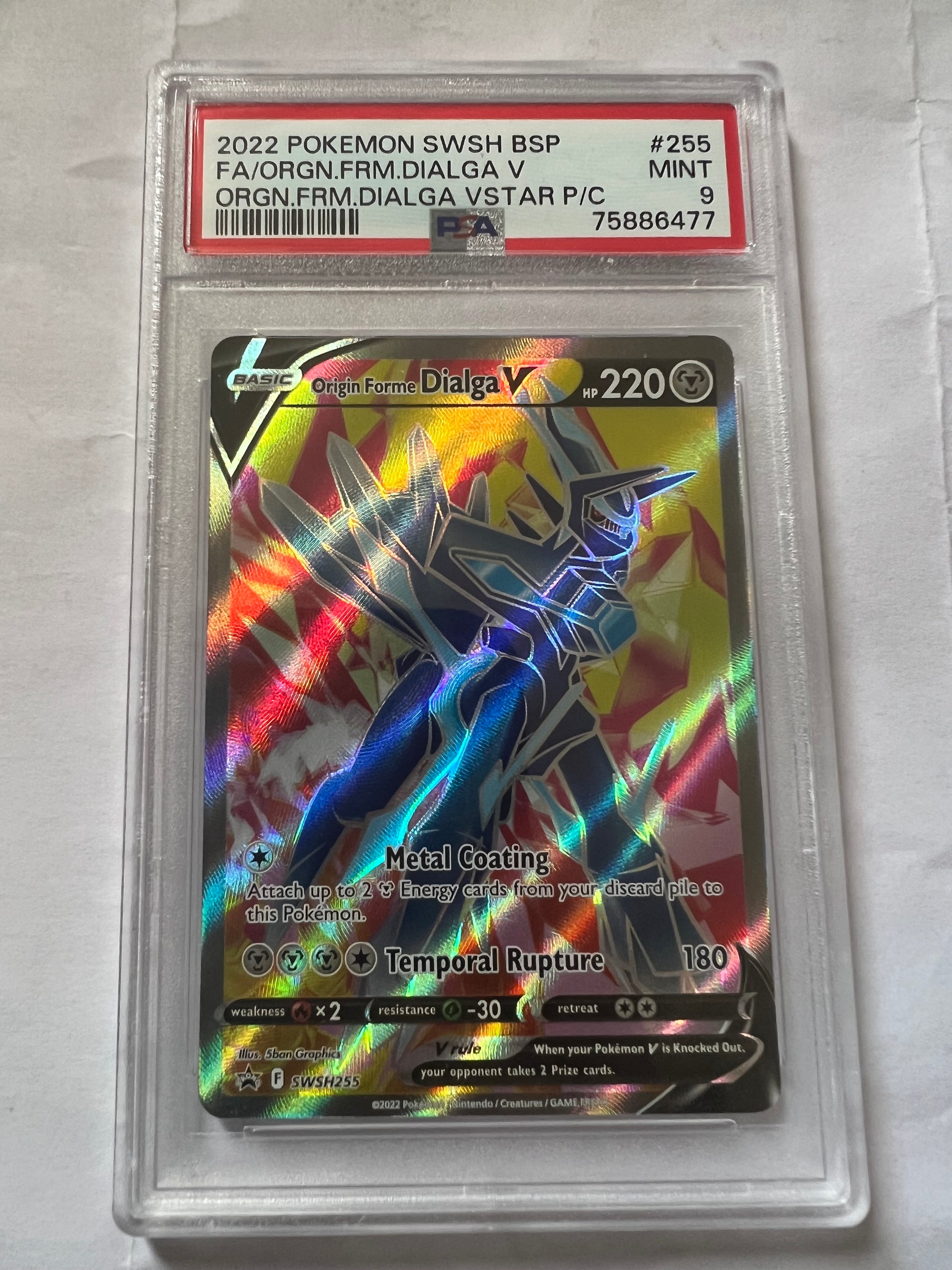 Origin Forme Dialga V Pokémon card featuring a stunning foil finish and PSA 9 quality, showcasing its powerful stats.